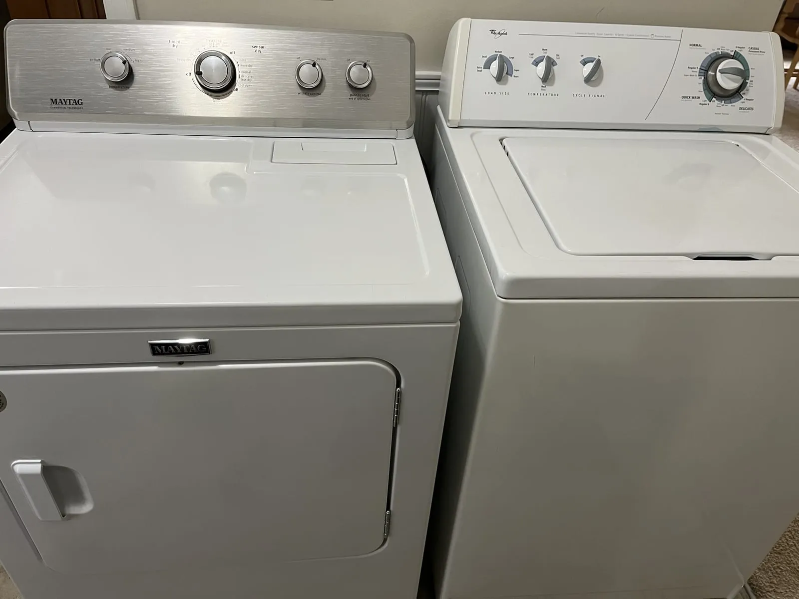 Top-load washer and dryer installed side by side and levelled