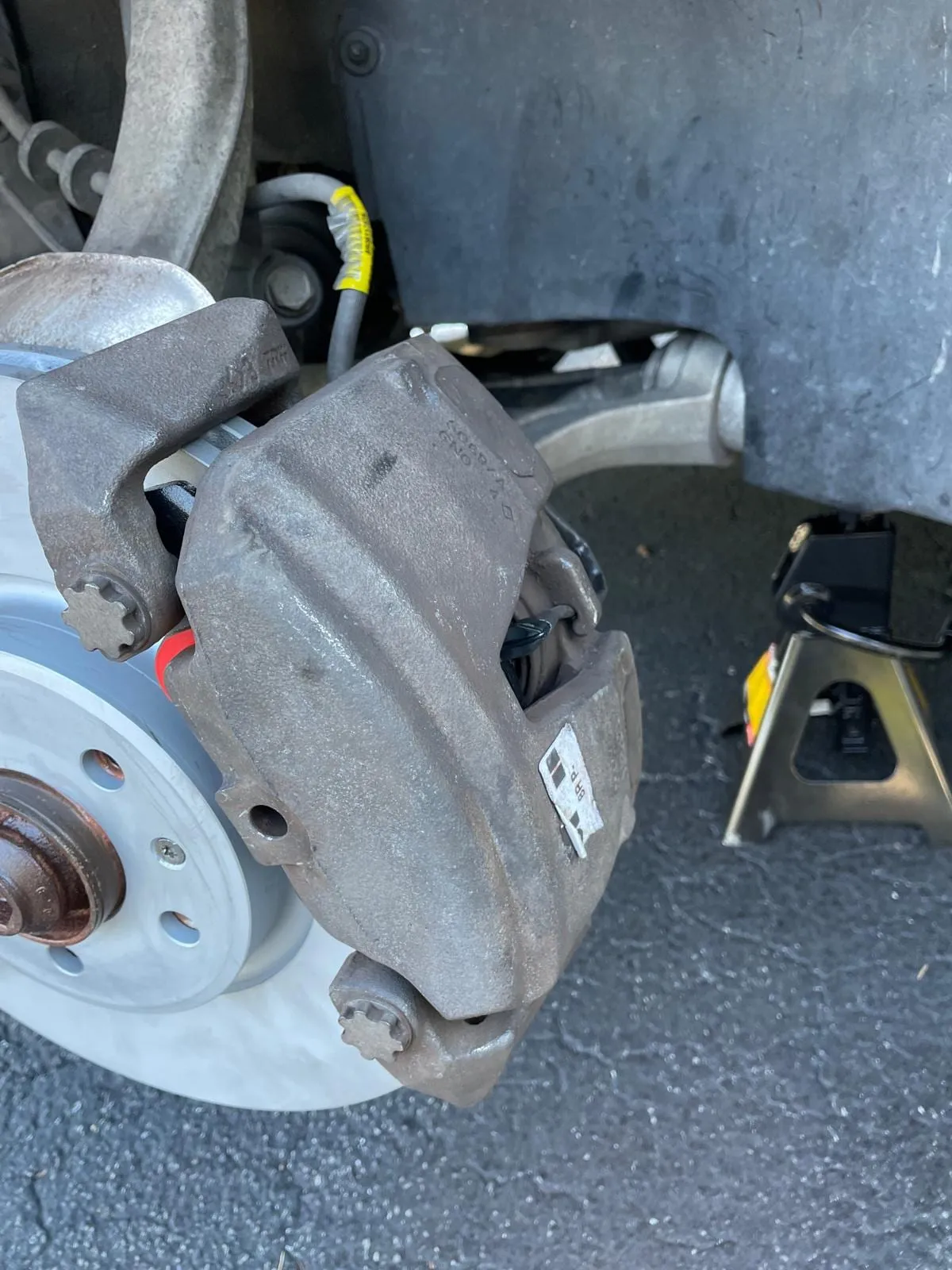 Brake assembly and hub exposed during a brake repair